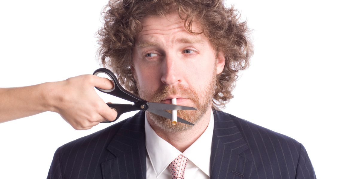 Man posing with a cigarette symbolising quitting a bad habit