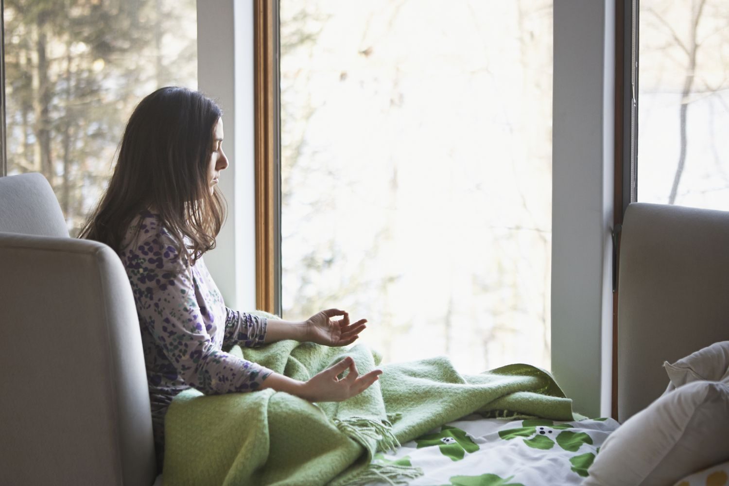 A woman practicing mindfulness on her own