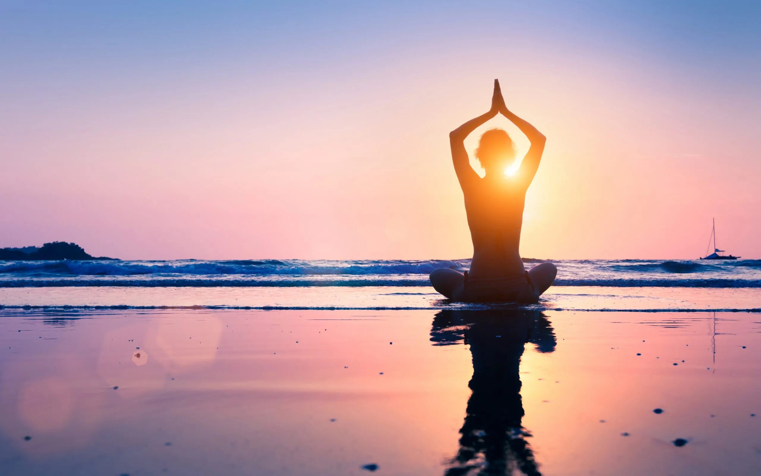 A woman on a mindfulness retreat doing a yoga pose