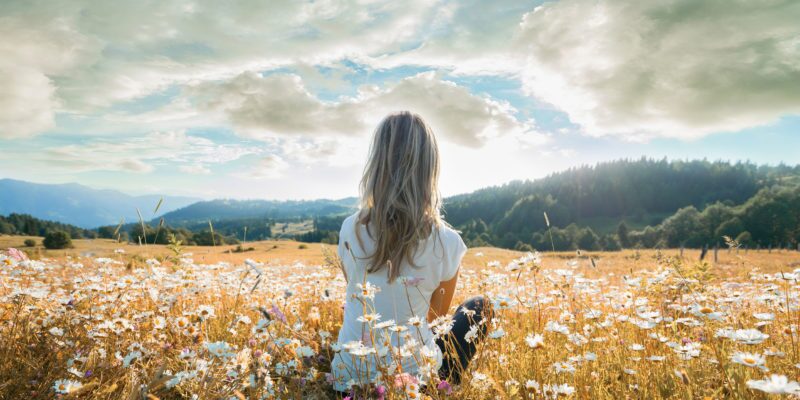 A woman sitting quietly during a mindful retreat